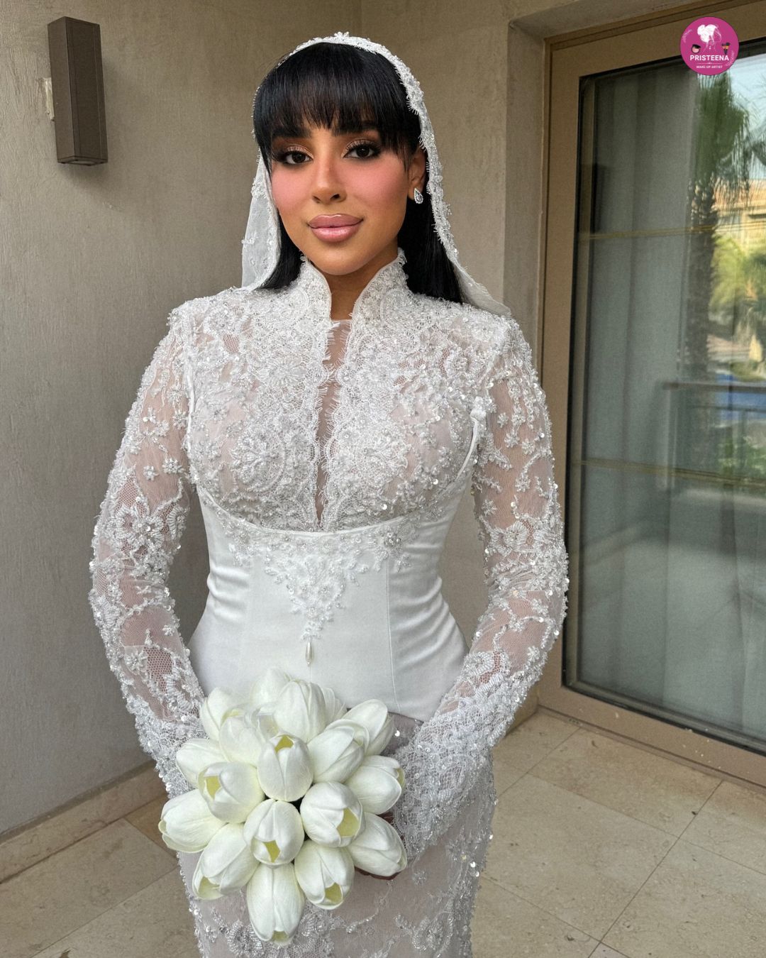 Asian bridal makeup artist in Dubai applying traditional bridal look on bride