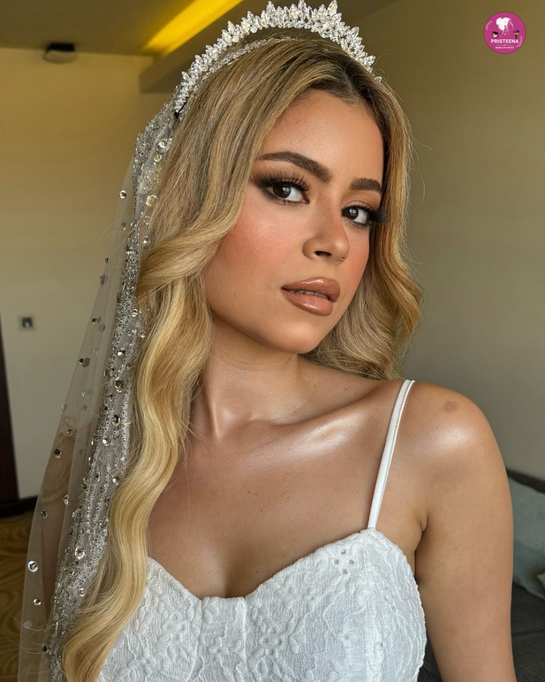 A professional Dubai makeup artist applying bridal makeup with precision, showcasing glamorous and flawless results.