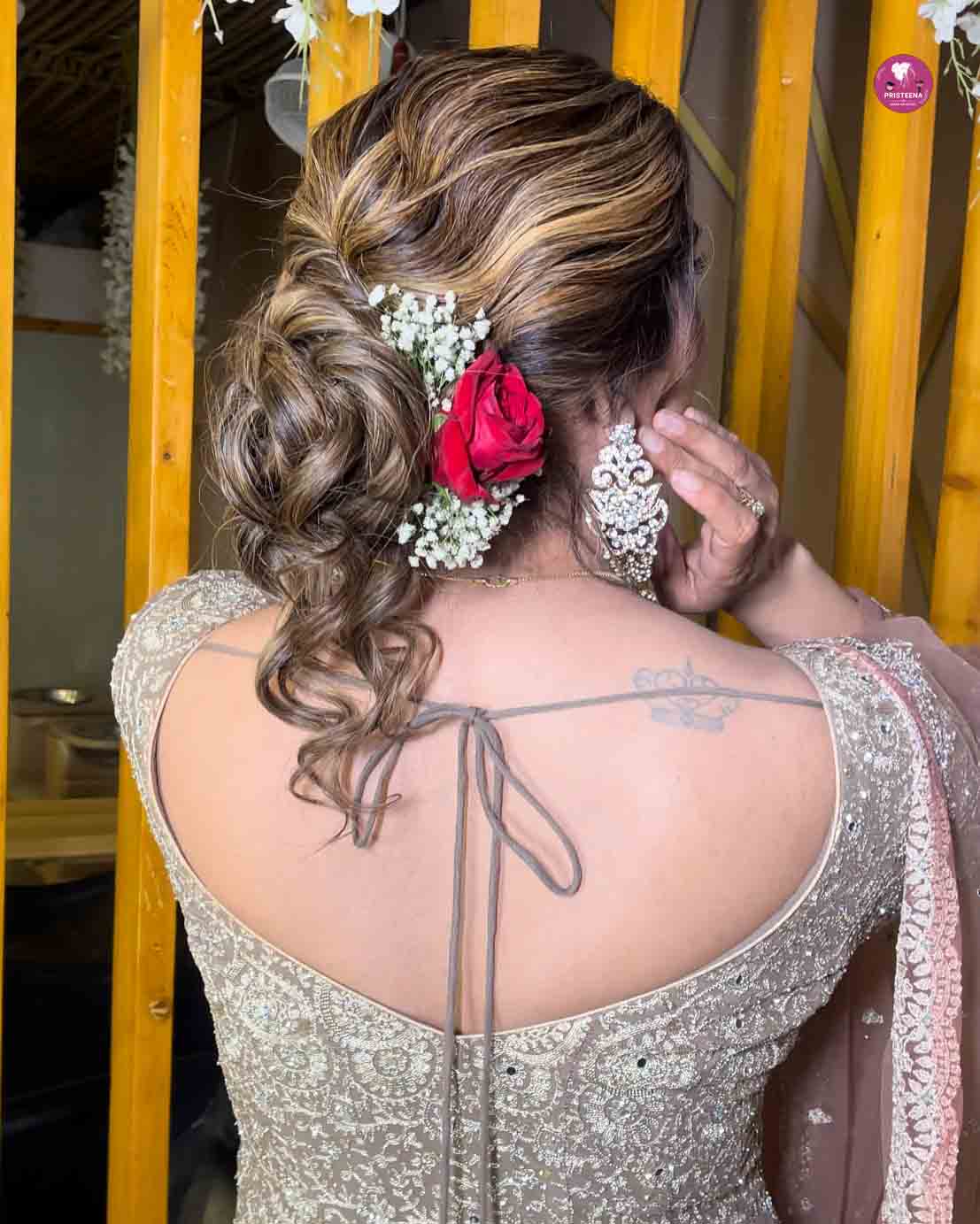A stylish woman showcasing the best hairstyle in Ajman at a professional salon.