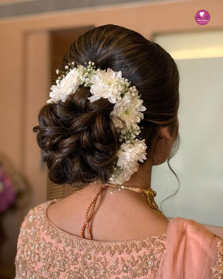 Elegant bridal hairstyle in Sharjah with traditional and modern touches for wedding day glamour.