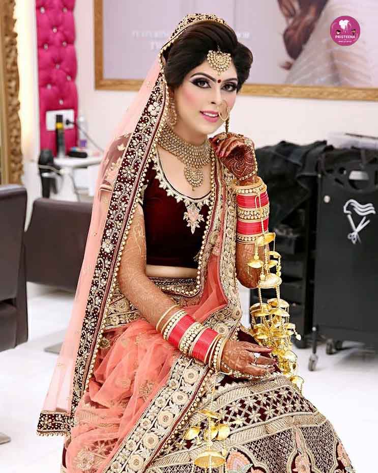 A bride with elegant traditional makeup and jewelry, showcasing professional bridal makeup in Sharjah.