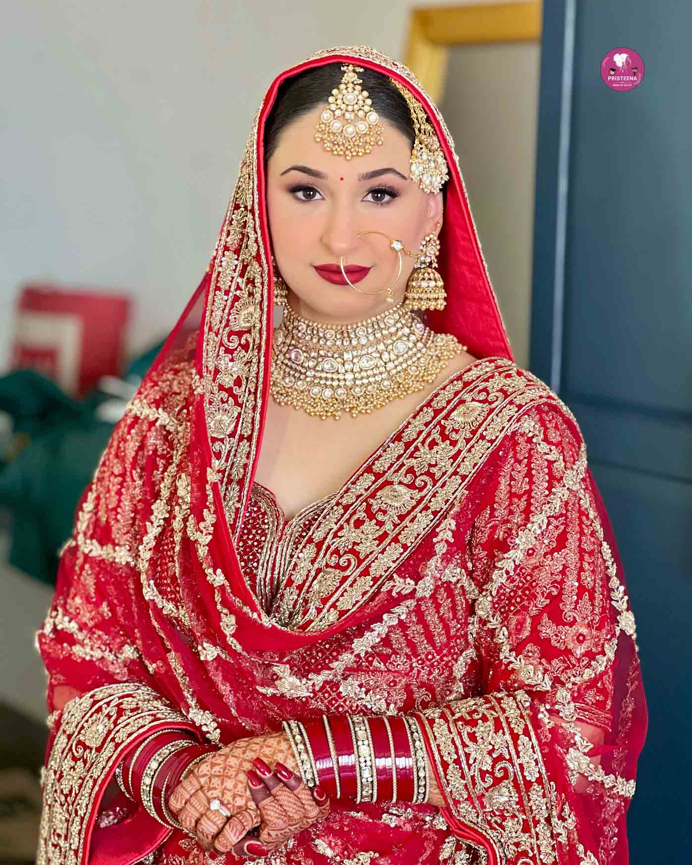 Bride with flawless bridal makeup featuring soft glam and elegant hairstyle.