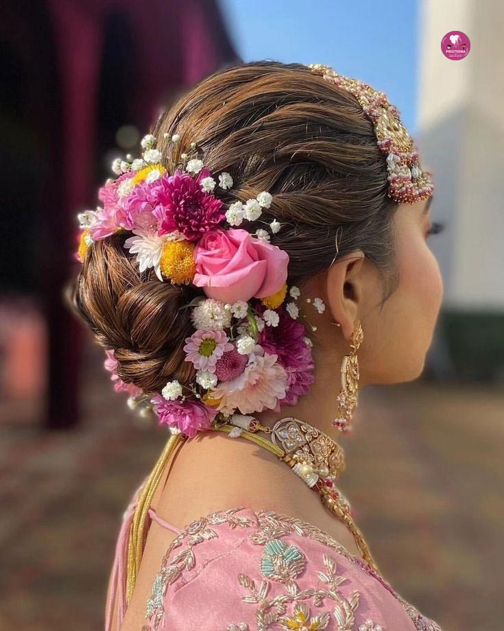 Elegant Indian bridal hairstyle with traditional jewelry and floral adornments
