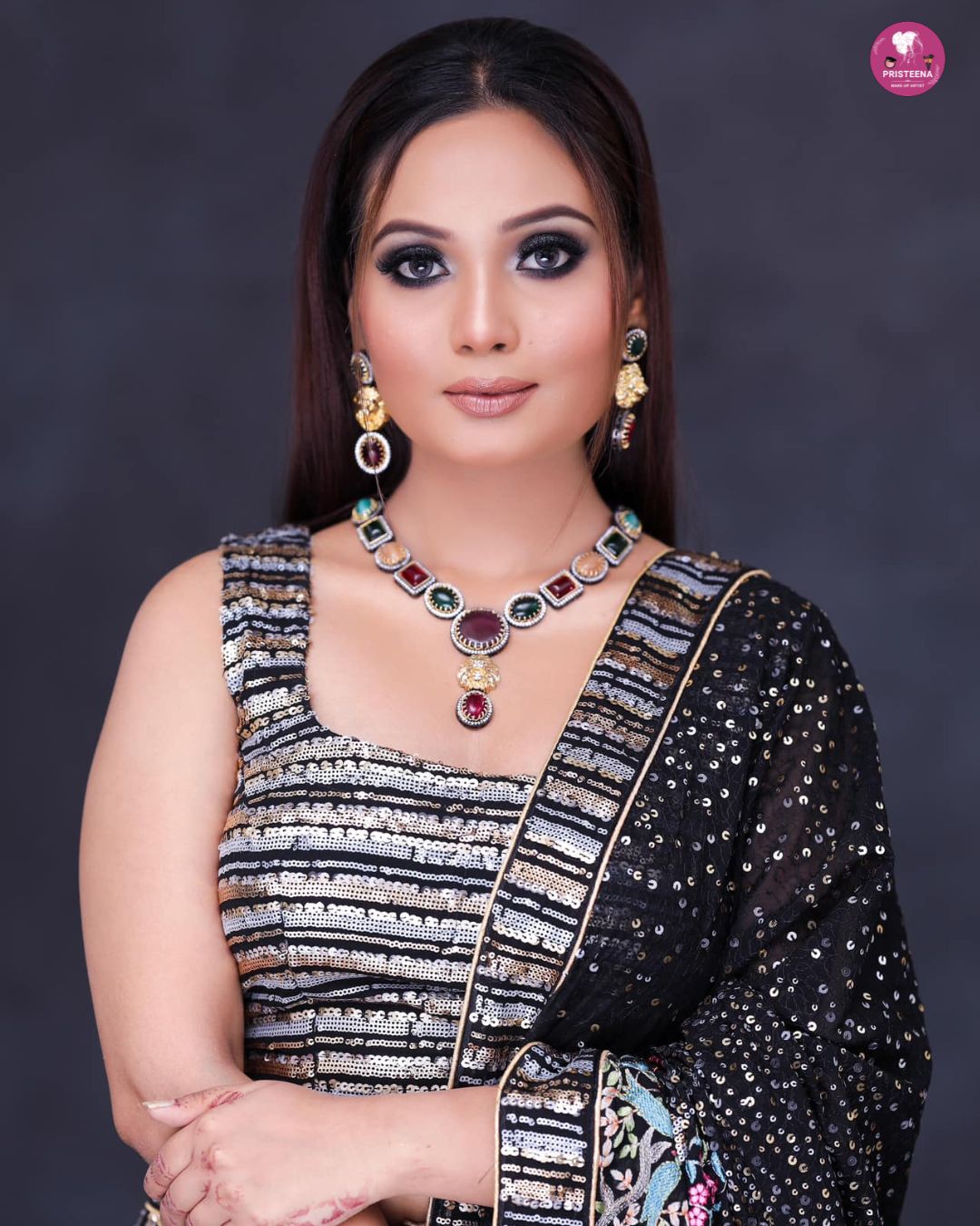 A professional makeup artist applying flawless makeup on a client in a luxury Dubai studio.