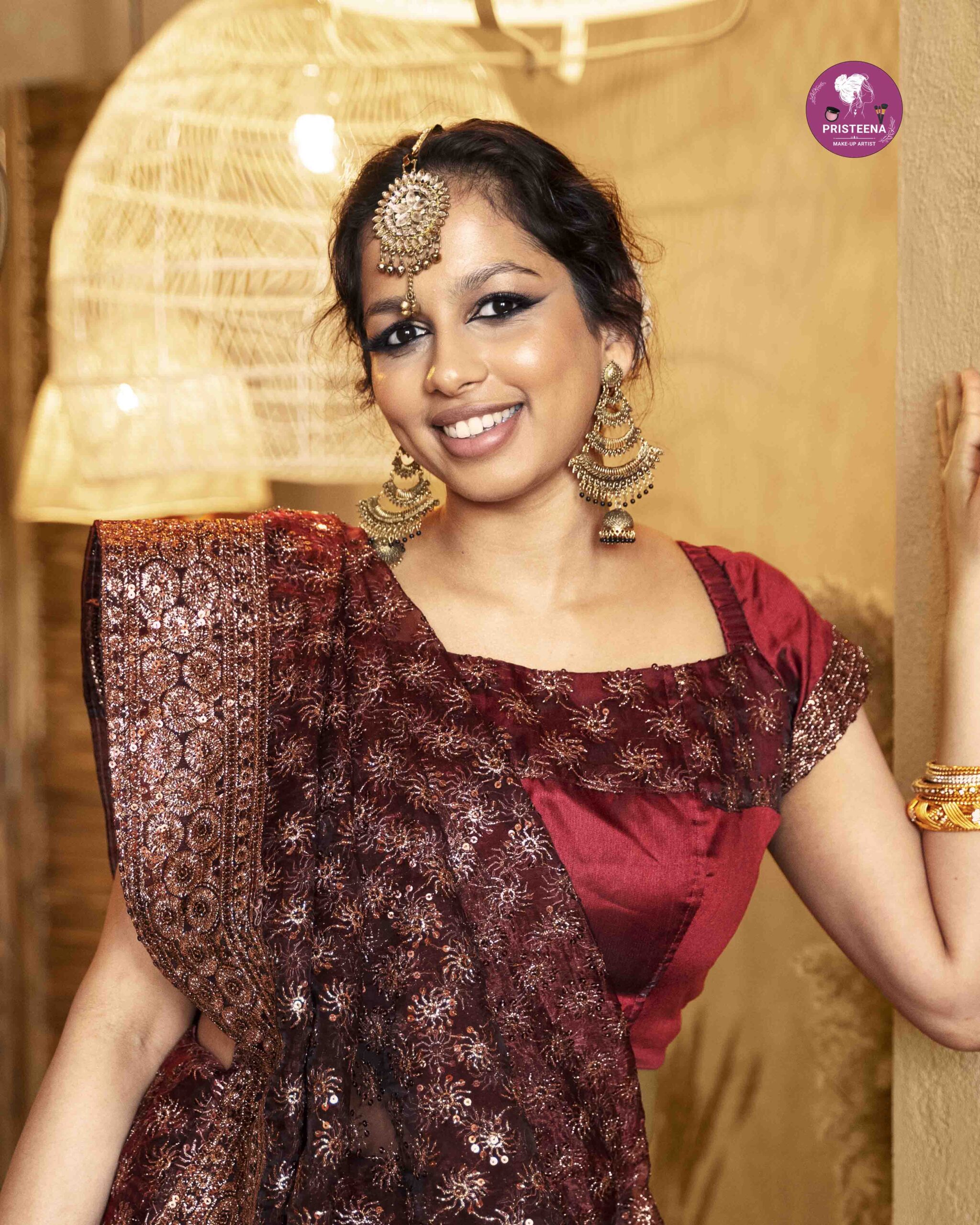 Woman with glamorous top party makeup featuring bold eyes and glowing skin.