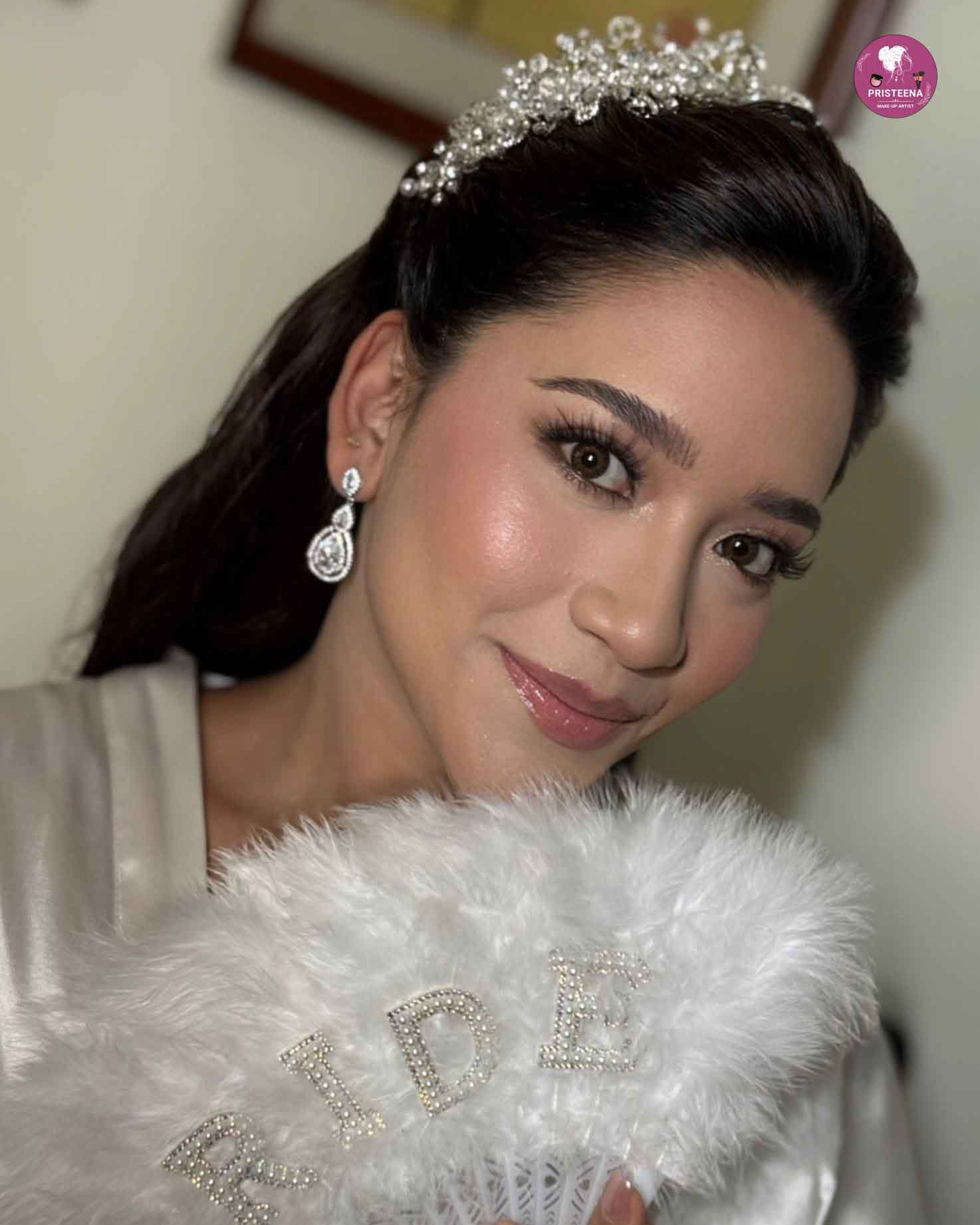 Bride wearing an elegant western bridal dress with lace details and a flowing white train.