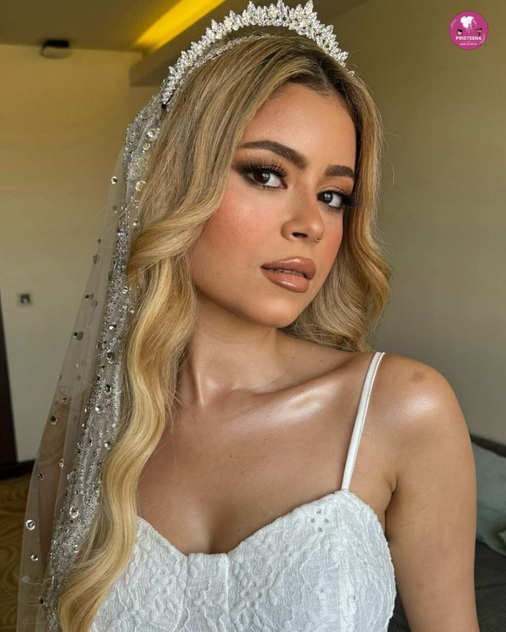 A professional Dubai makeup artist applying bridal makeup with precision, showcasing glamorous and flawless results.