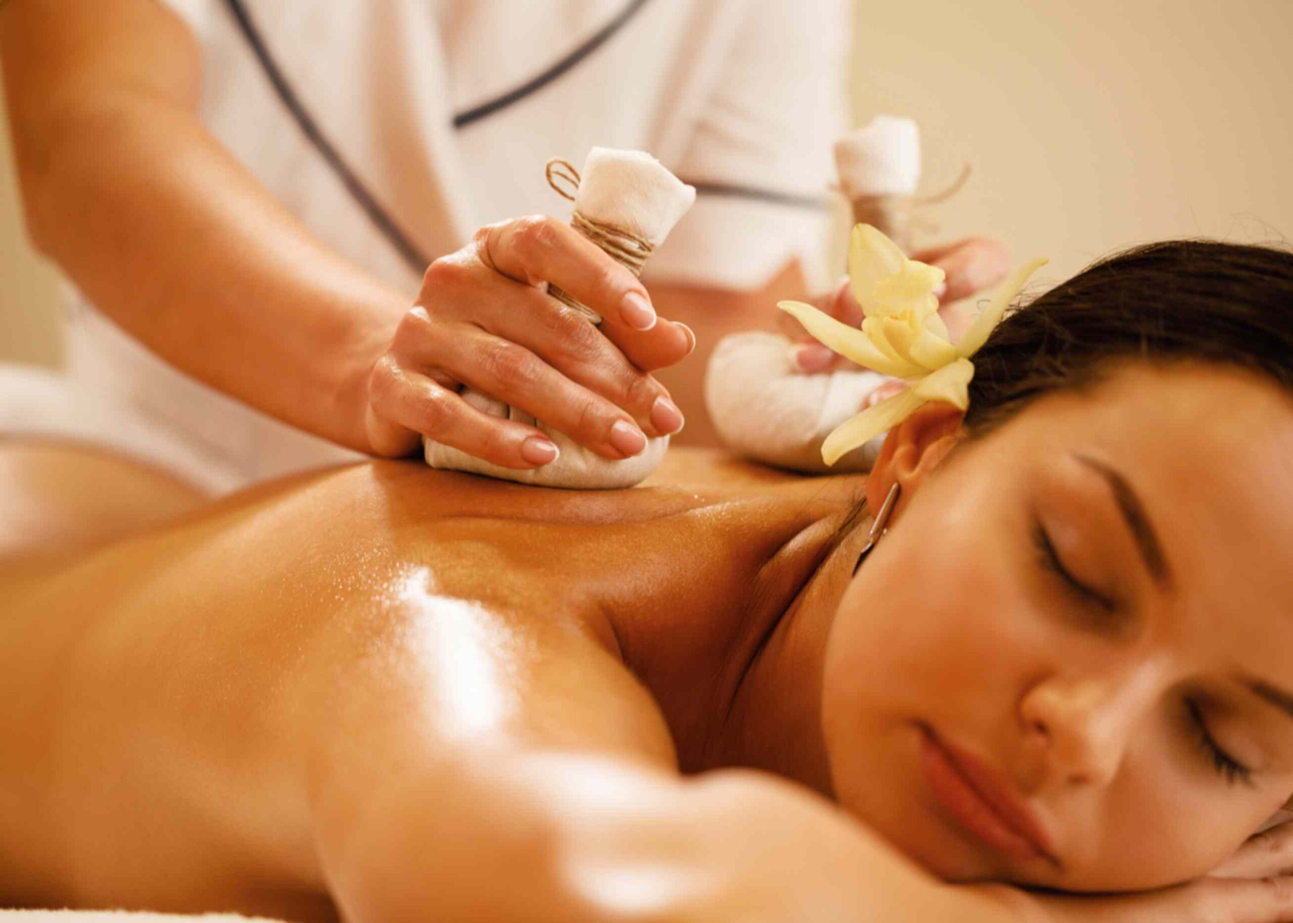 a lady getting thai massage at home in uae